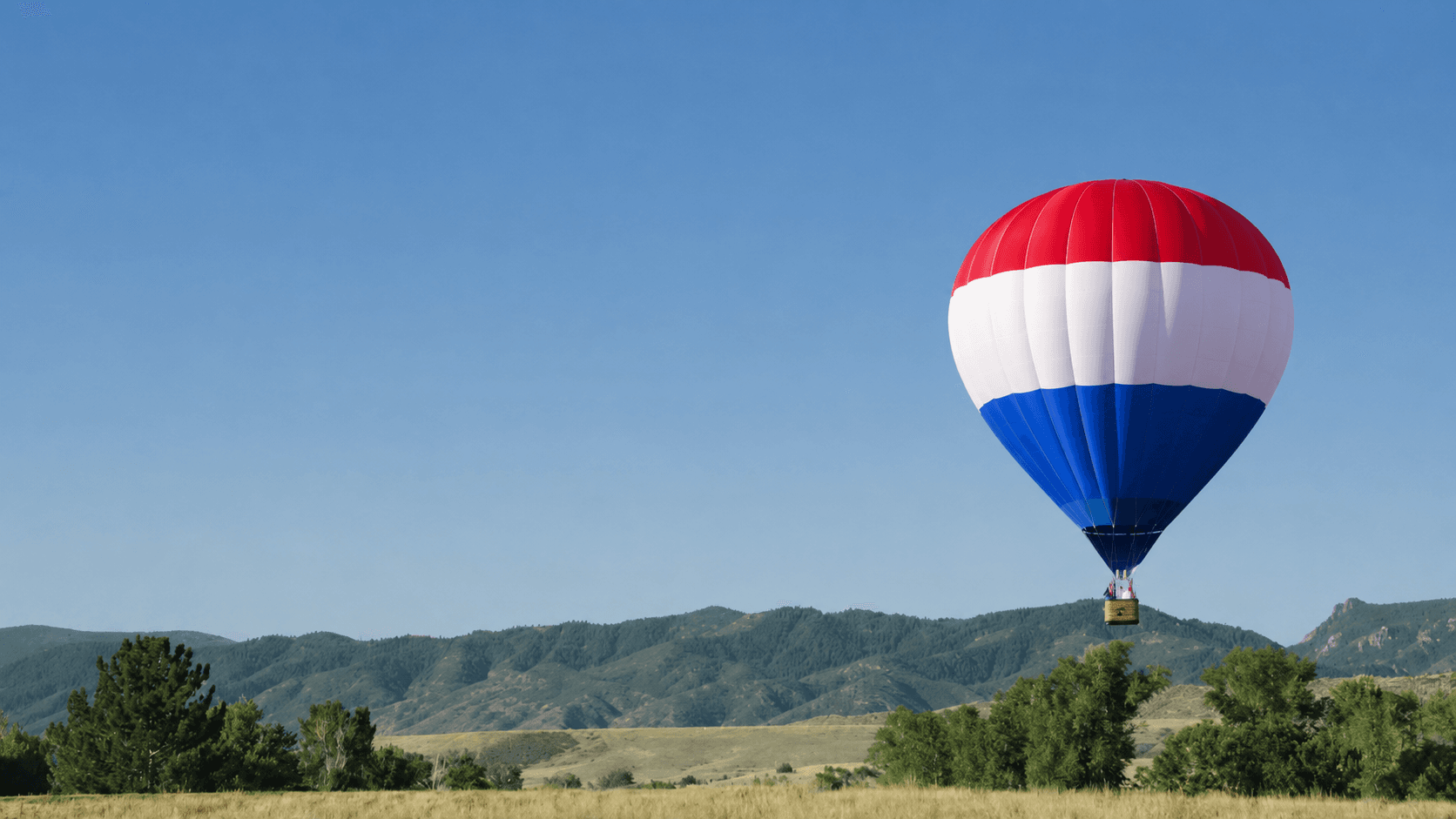 REMAX hot air balloon over countryside